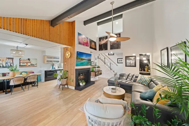 a living room with furniture and fireplace