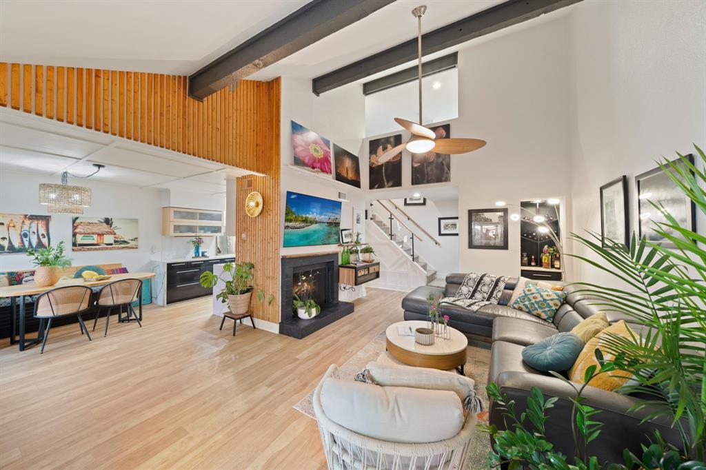 a living room with furniture and fireplace