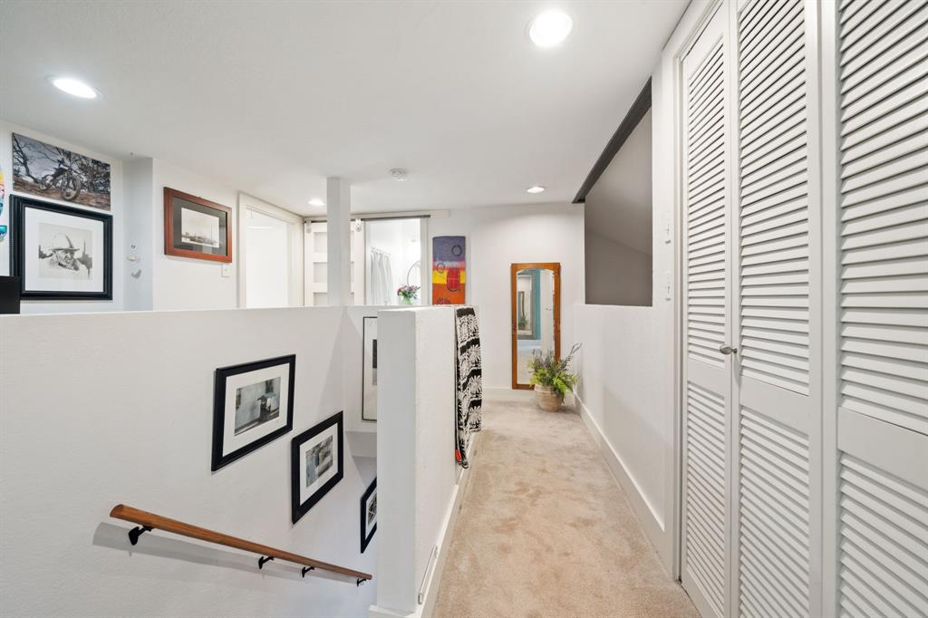 7496 East Northwest Highway, Unit 145 Dallas, TX 75231 - Photo 16 of 35 a view of a hallway with workspace