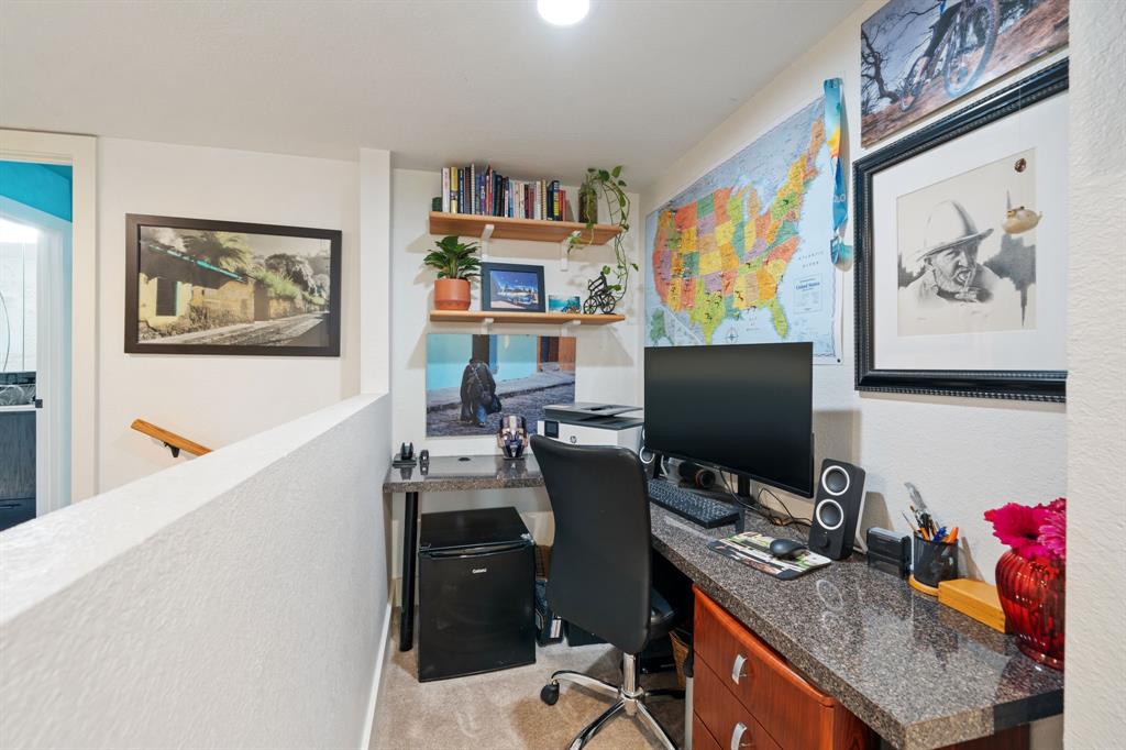 7496 East Northwest Highway, Unit 145 Dallas, TX 75231 - Photo 17 of 35 a view of a workspace with furniture and a window