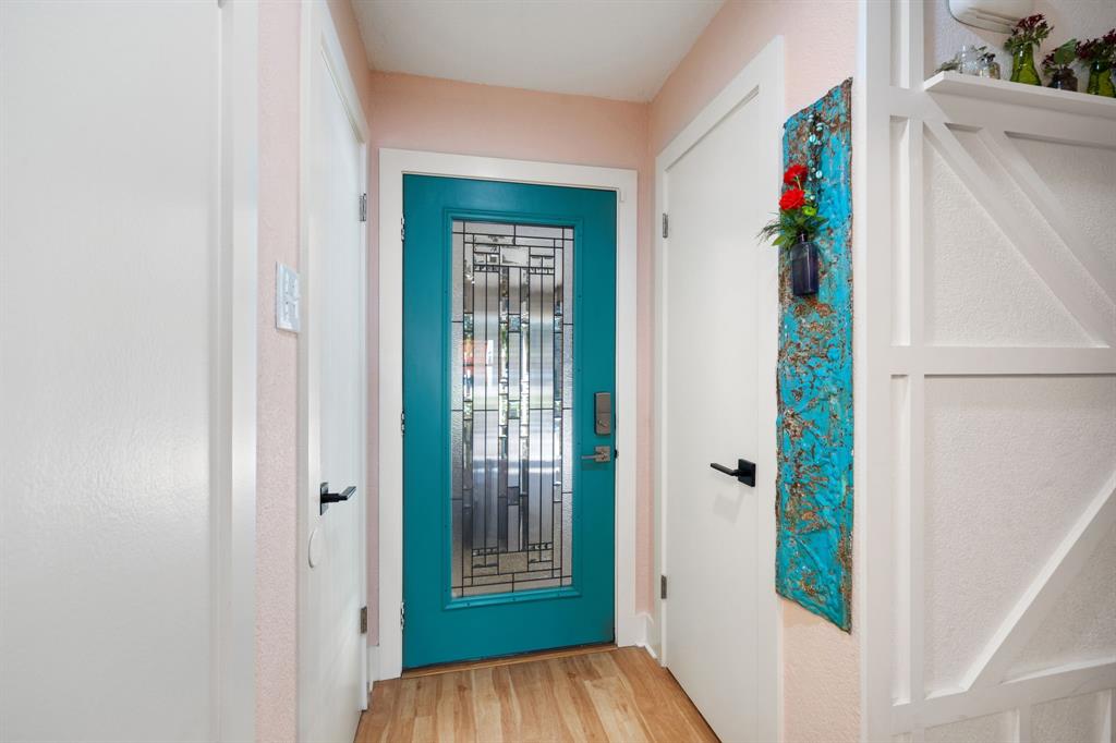 7496 East Northwest Highway, Unit 145 Dallas, TX 75231 - Photo 2 of 35 a view of entryway with wooden floor