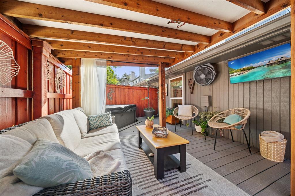 7496 East Northwest Highway, Unit 145 Dallas, TX 75231 - Photo 27 of 35 a outdoor living space with furniture and a black umbrella