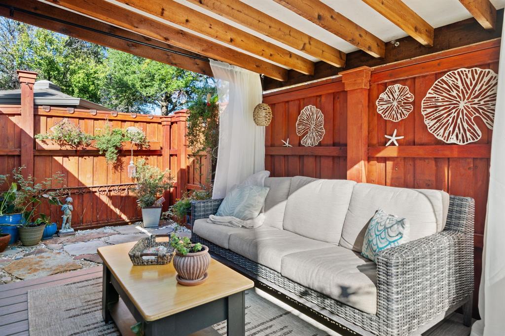 7496 East Northwest Highway, Unit 145 Dallas, TX 75231 - Photo 29 of 35 a living room with furniture and a large window