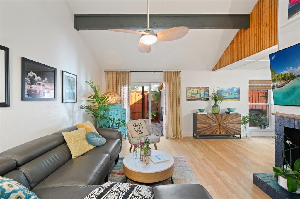 7496 East Northwest Highway, Unit 145 Dallas, TX 75231 - Photo 9 of 35 a living room with furniture potted plant and a large window