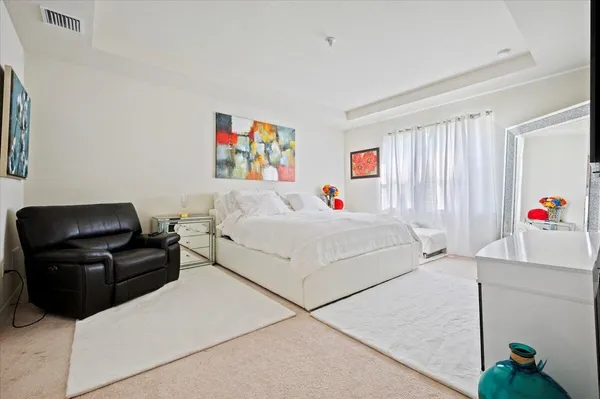 a bedroom with furniture and a couch