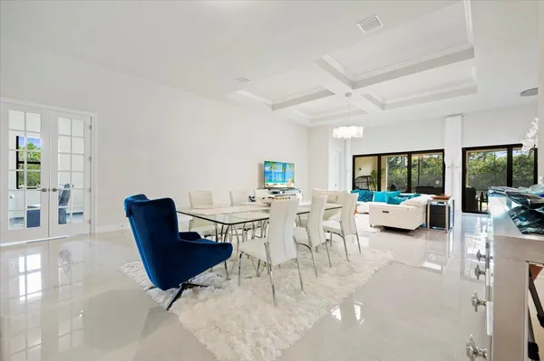 a view of a dining room with furniture window and outside view