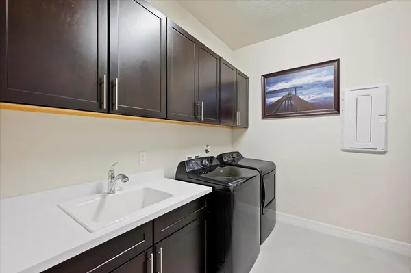a utility room with cabinets