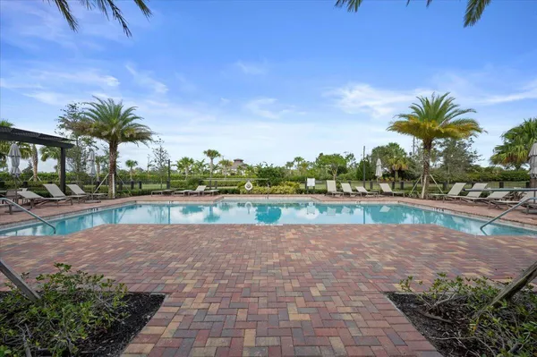 a view of swimming pool with a yard