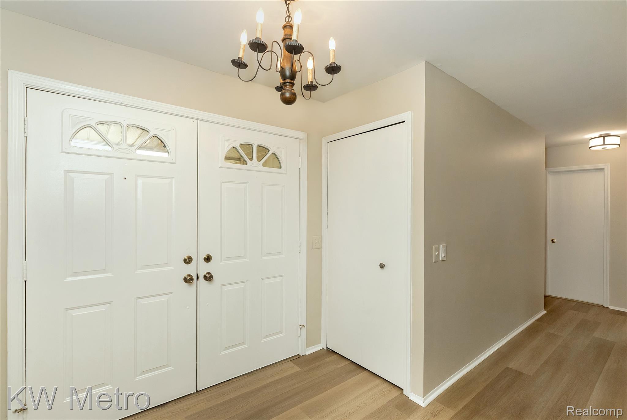 2154 Warrington Road Rochester, MI 48307 - Photo 9 of 41 Entryway featuring double panel doors with arched transom windows