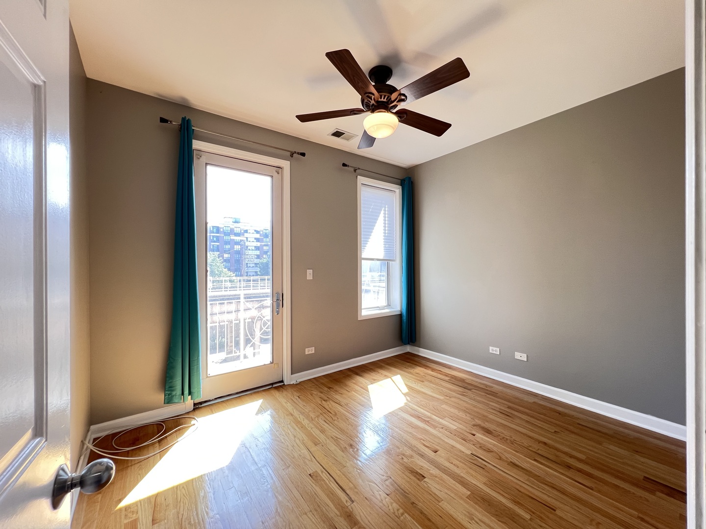 1911 South State Street, Unit 3 Chicago, IL 60616 - Photo 18 of 26 an empty room with wooden floor fan and windows