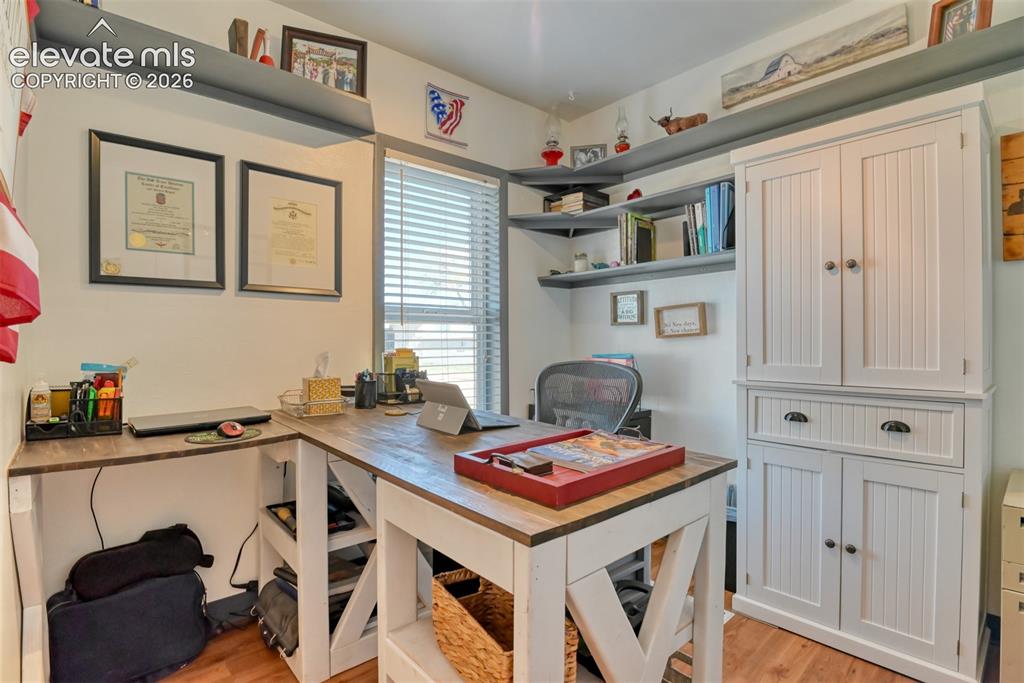 22558 Enoch Road Calhan, CO 80808 - Photo 38 of 50 a view of a workspace with furniture