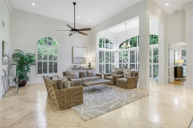 a living room with furniture and windows