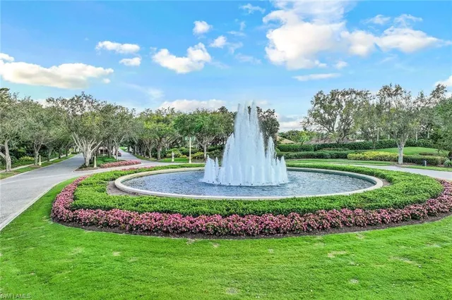 a view of a garden with large trees