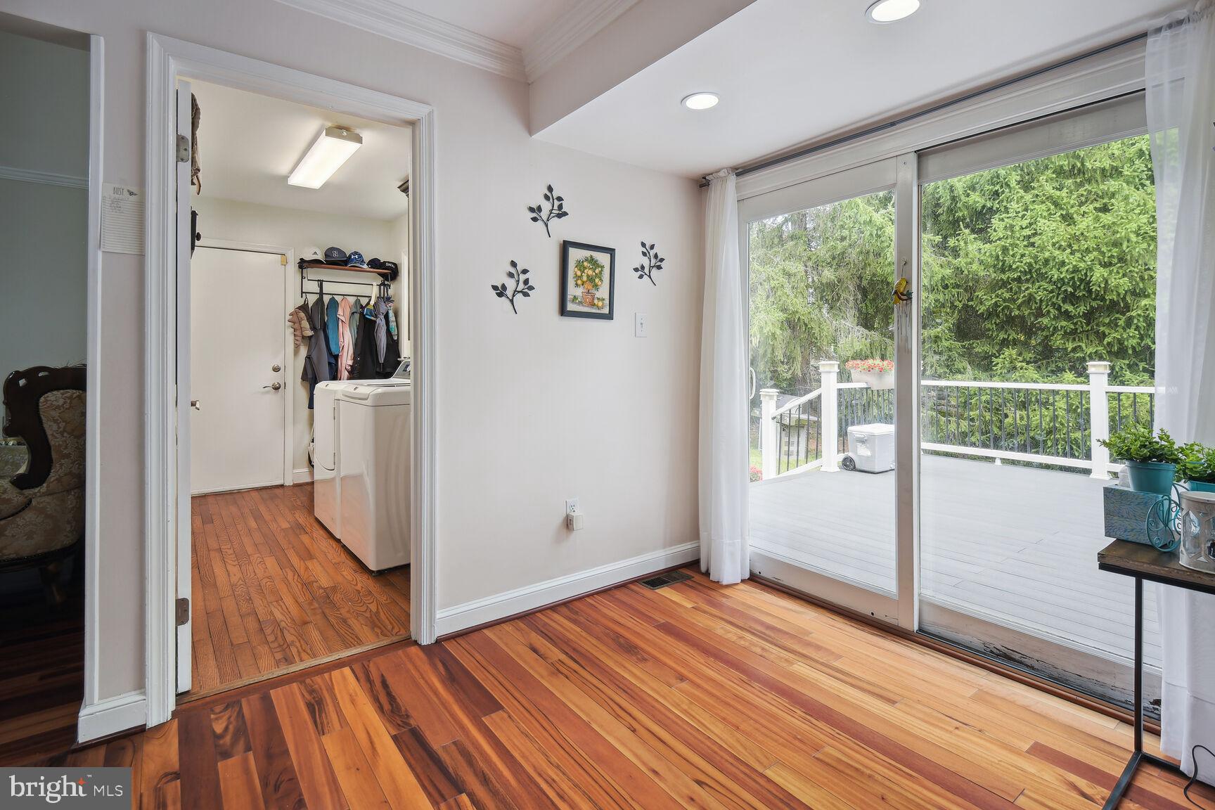 12324 Triple Crown Road North Potomac, MD 20878 - Photo 11 of 49 a view of empty room with wooden floor and fan