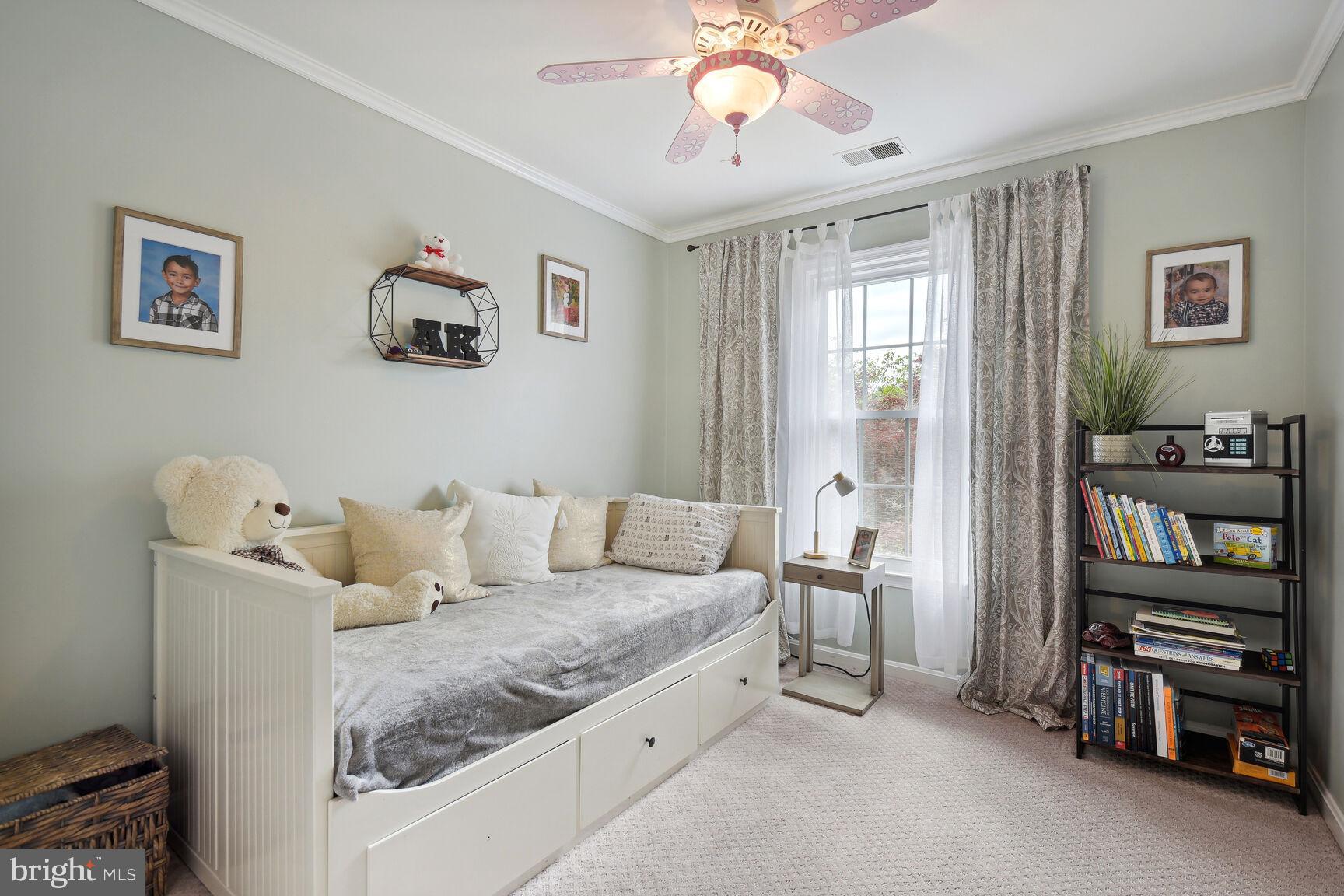 12324 Triple Crown Road North Potomac, MD 20878 - Photo 24 of 49 a living room with furniture and a flat screen tv