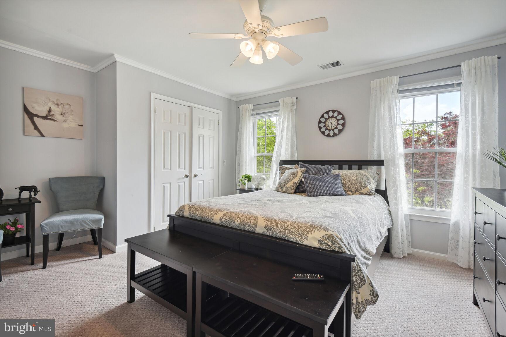 12324 Triple Crown Road North Potomac, MD 20878 - Photo 25 of 49 a bedroom with a bed a table and chair