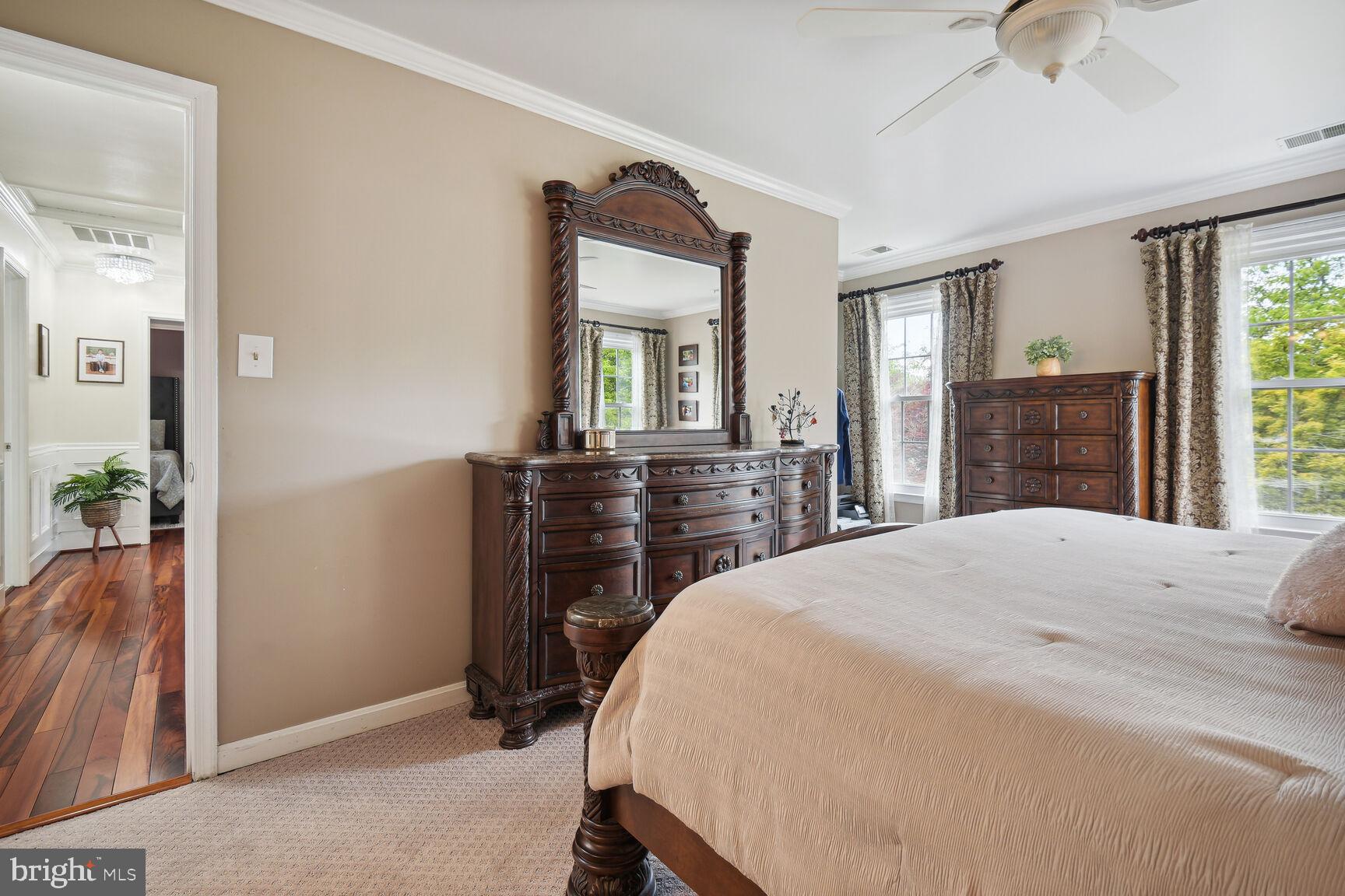 12324 Triple Crown Road North Potomac, MD 20878 - Photo 29 of 49 a bedroom with a bed and a dresser