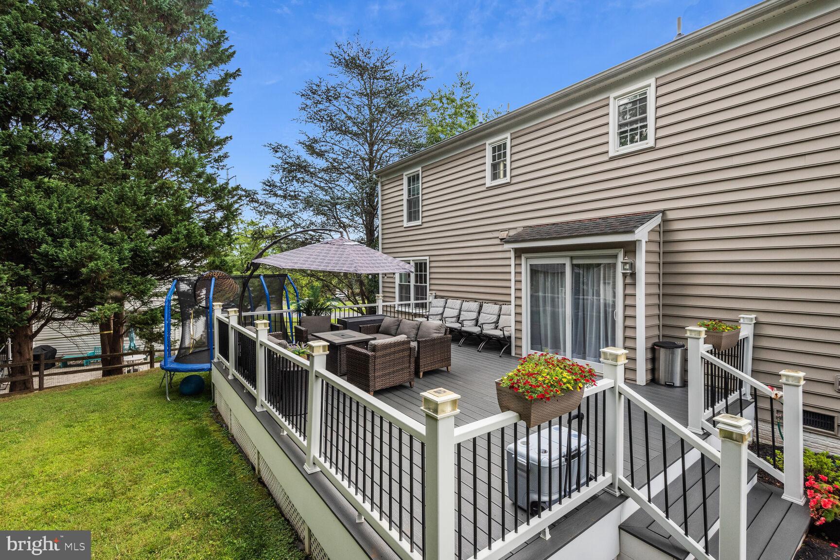 12324 Triple Crown Road North Potomac, MD 20878 - Photo 42 of 49 a view of a house with backyard and sitting area
