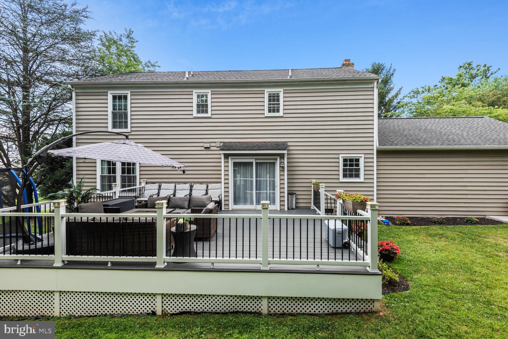 12324 Triple Crown Road North Potomac, MD 20878 - Photo 43 of 49 a view of a house with a small yard and a large window