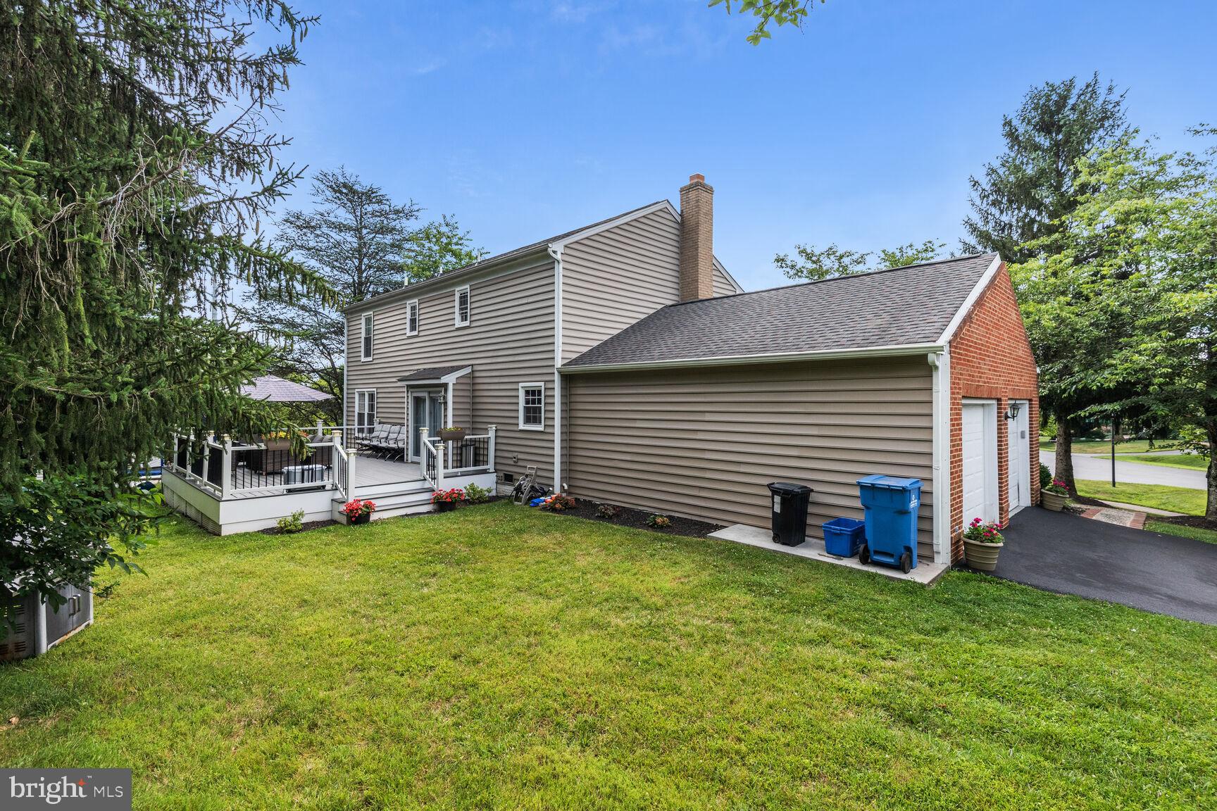 12324 Triple Crown Road North Potomac, MD 20878 - Photo 44 of 49 a view of a house with backyard porch and sitting area