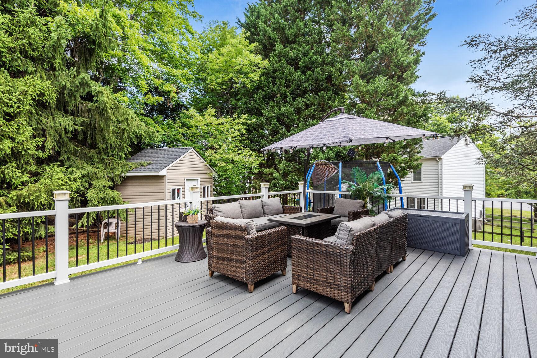 12324 Triple Crown Road North Potomac, MD 20878 - Photo 47 of 49 a view of a patio with couches chairs and wooden floor