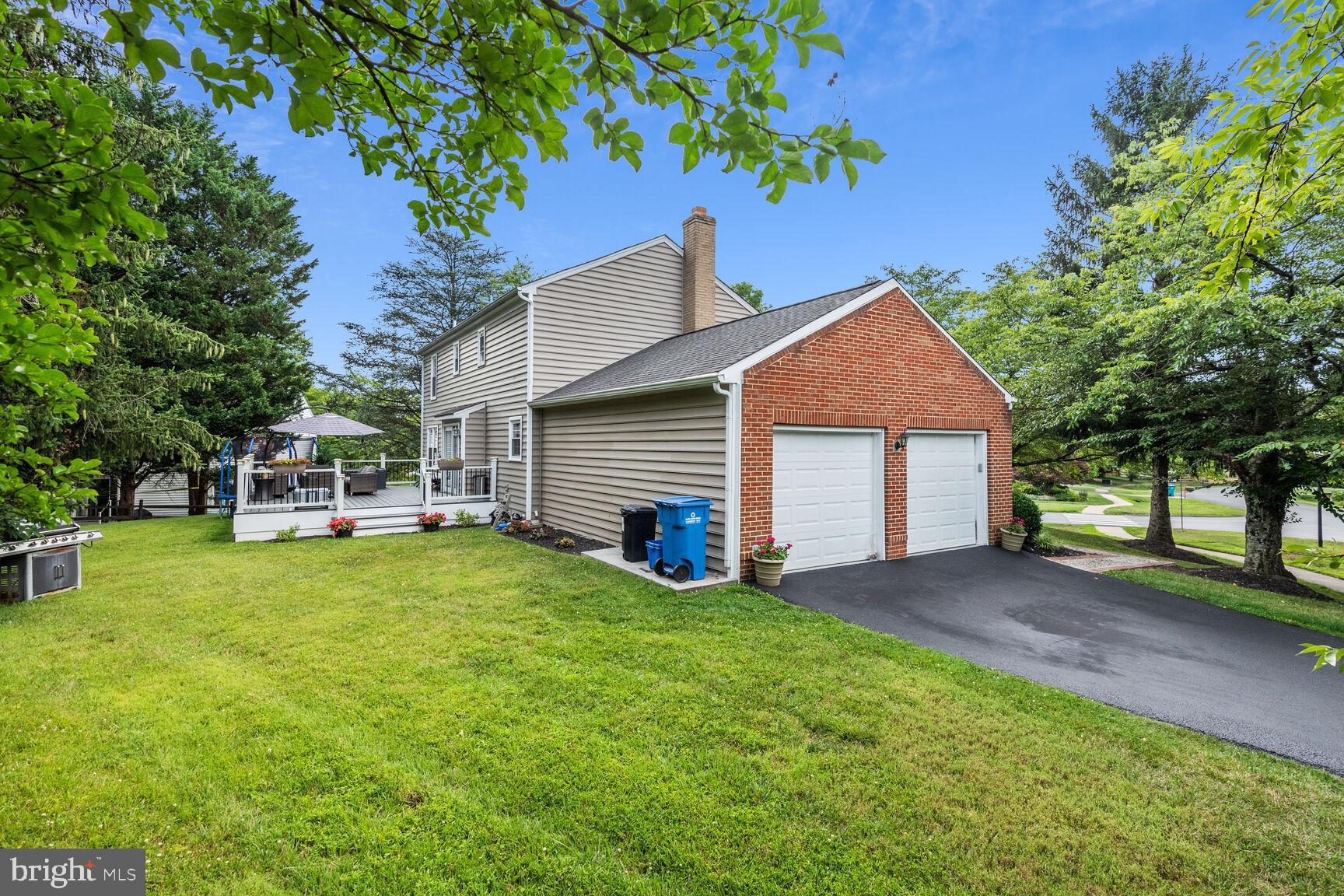 12324 Triple Crown Road North Potomac, MD 20878 - Photo 48 of 49 a front view of a house with a yard and trees