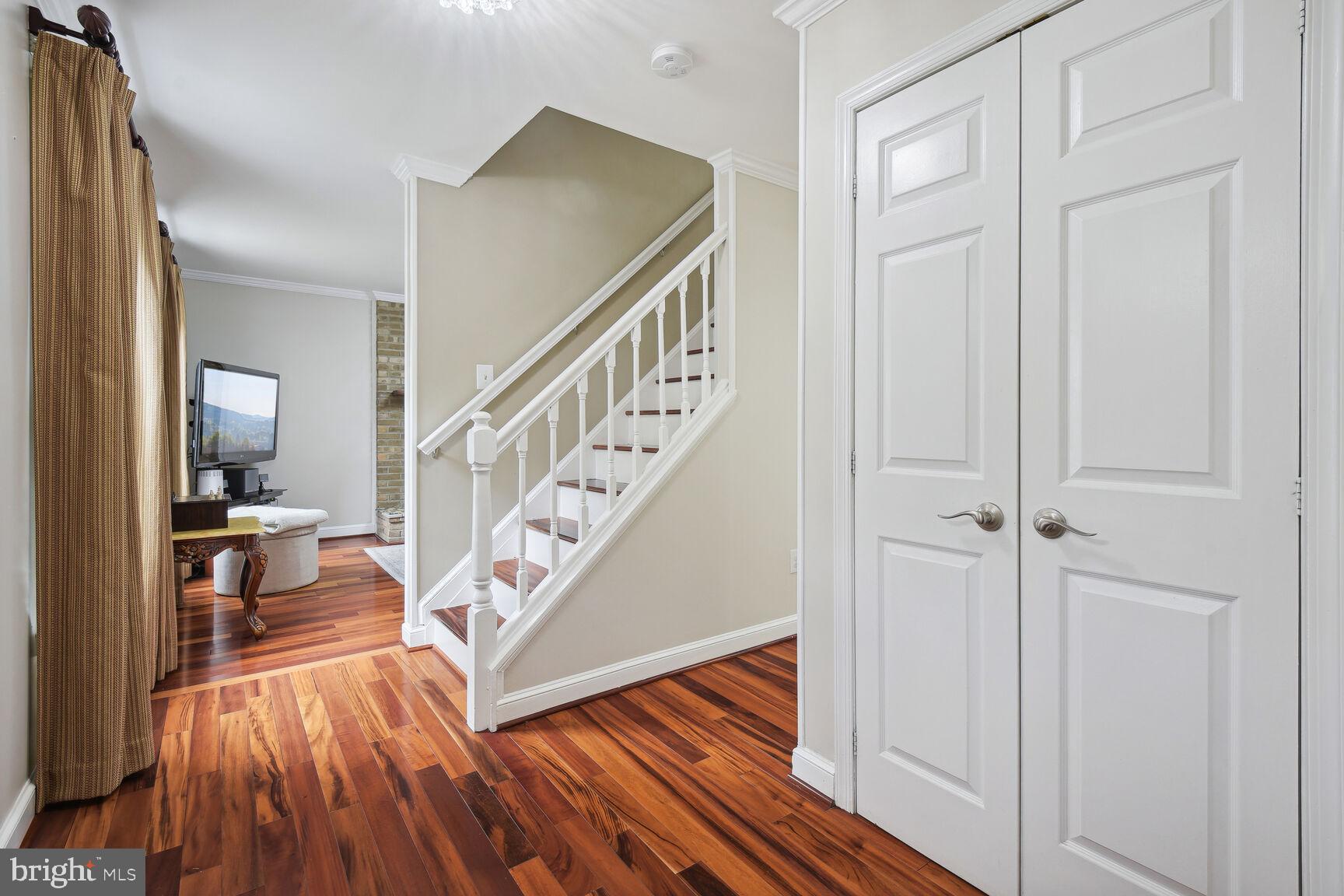 12324 Triple Crown Road North Potomac, MD 20878 - Photo 5 of 49 a view of front door with wooden floor and stairs