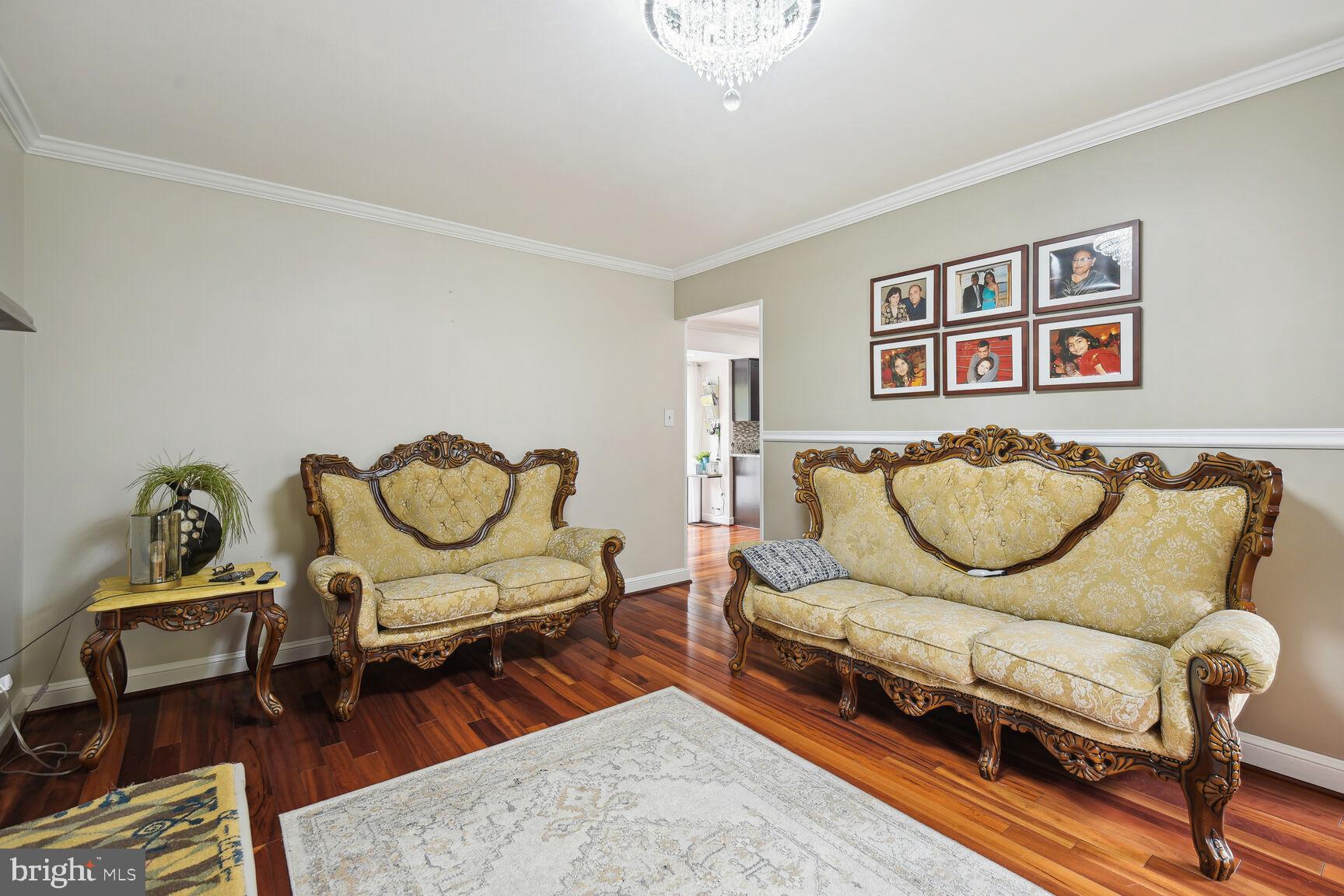 12324 Triple Crown Road North Potomac, MD 20878 - Photo 10 of 49 a living room with furniture a rug and wooden floor