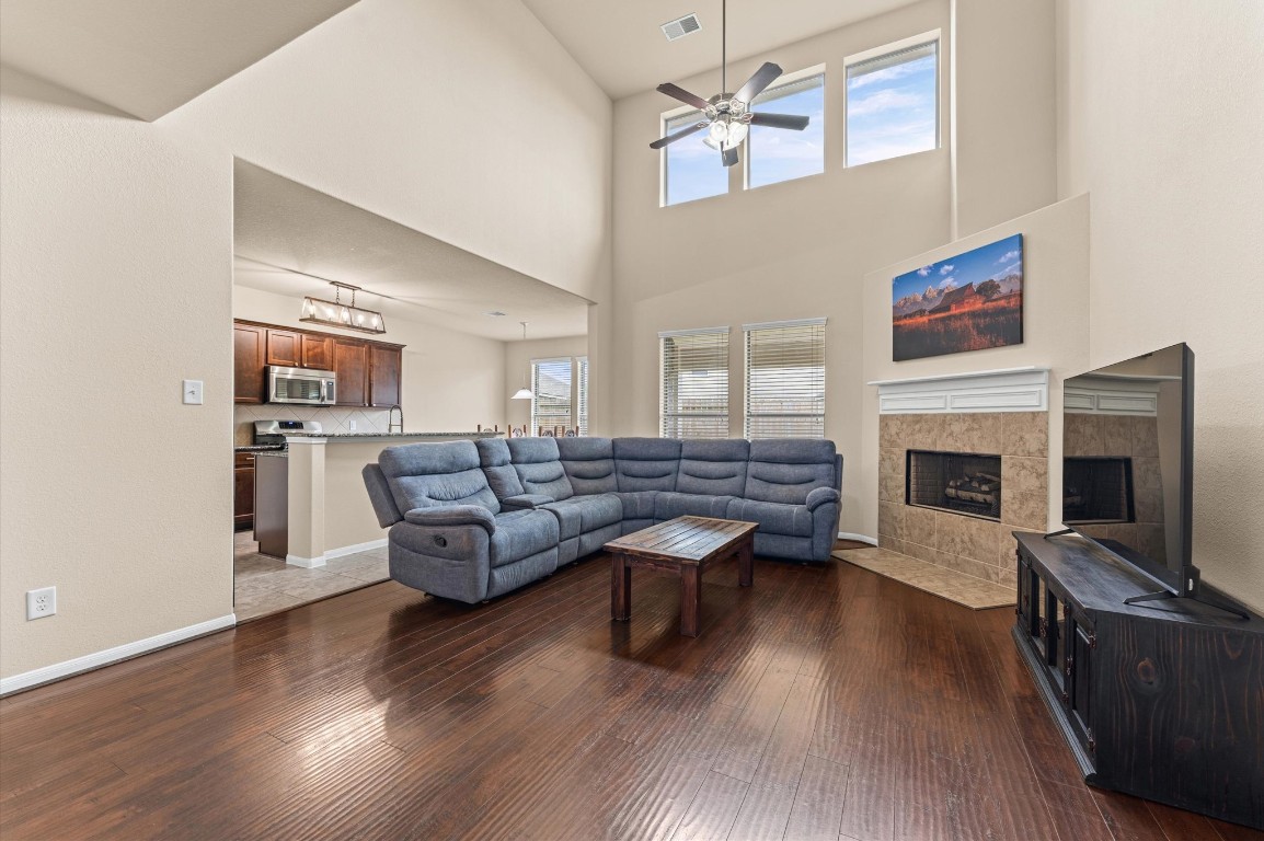 22534 Rustic Valley Court Porter, TX 77365 - Photo 12 of 27 a living room with furniture fireplace and flat screen tv