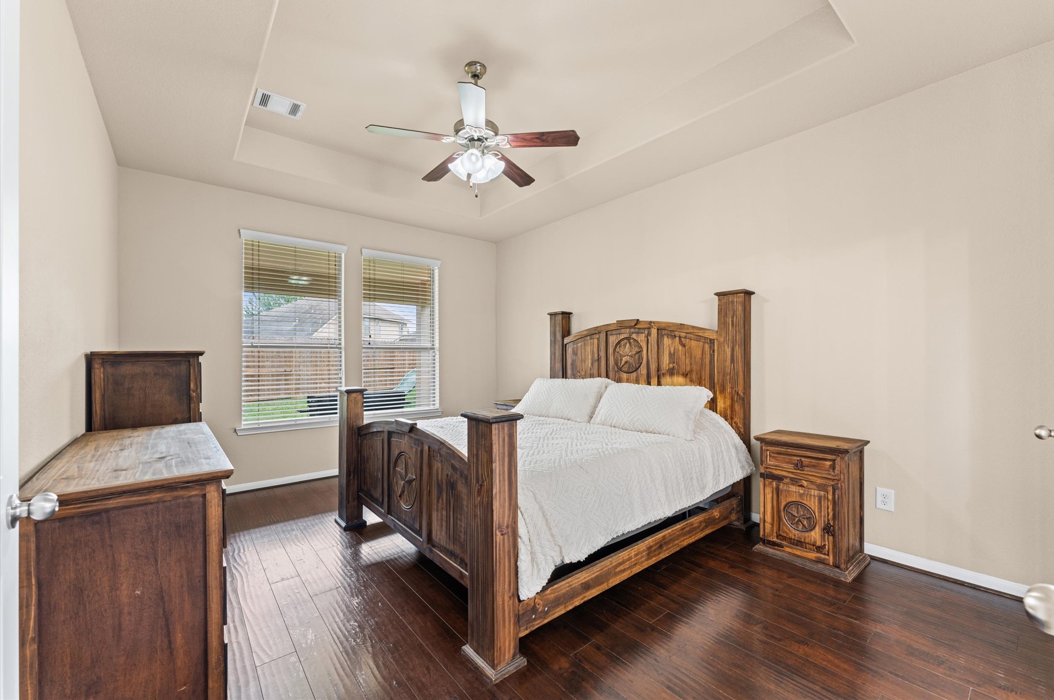 22534 Rustic Valley Court Porter, TX 77365 - Photo 14 of 27 a bedroom with a bed and wooden floor