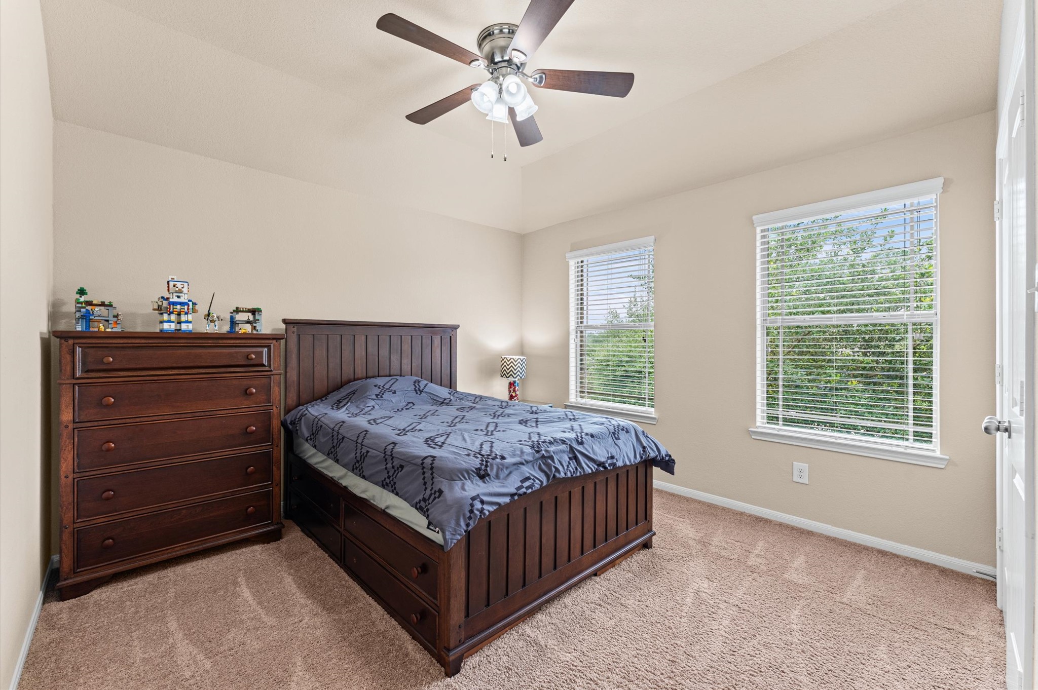 22534 Rustic Valley Court Porter, TX 77365 - Photo 16 of 27 a bedroom with a bed and a dresser