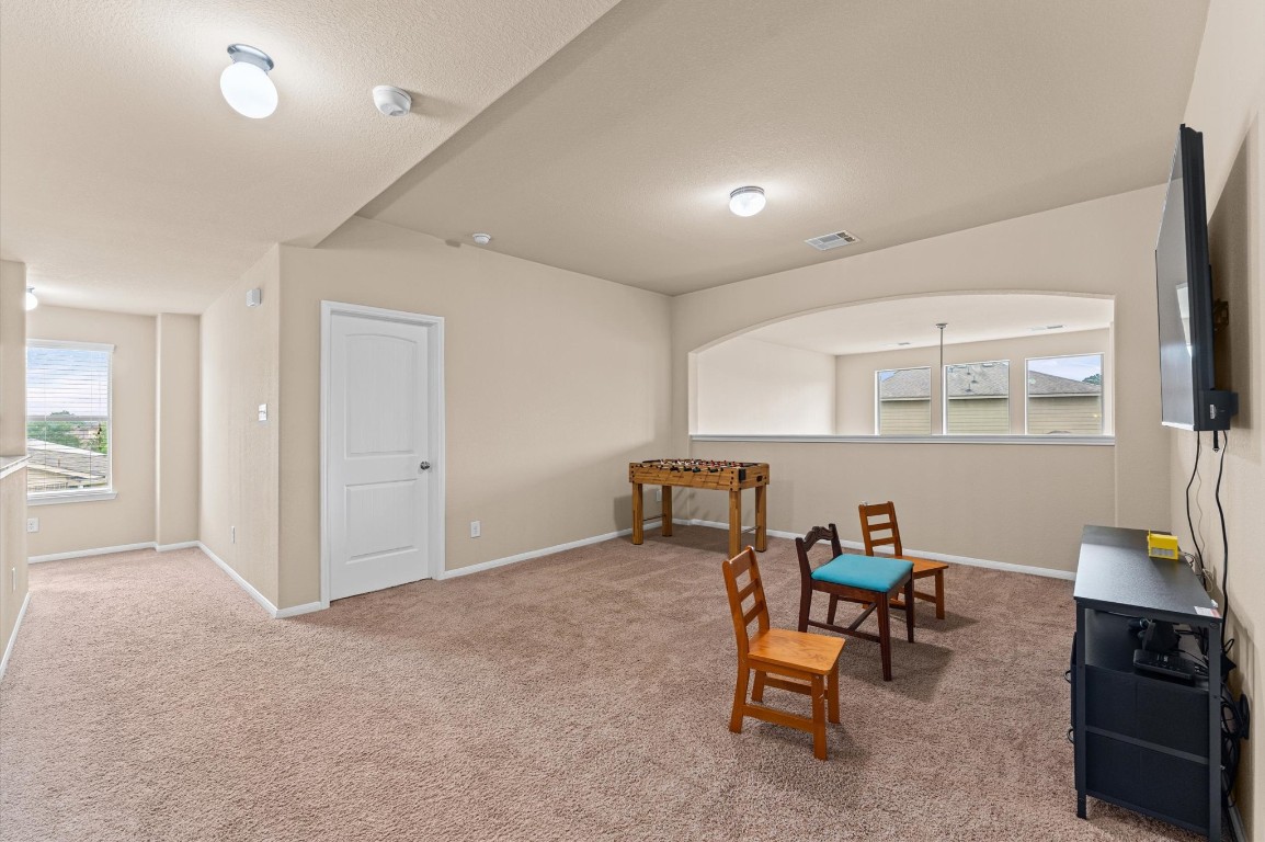 22534 Rustic Valley Court Porter, TX 77365 - Photo 19 of 27 a view of a livingroom with furniture and a window