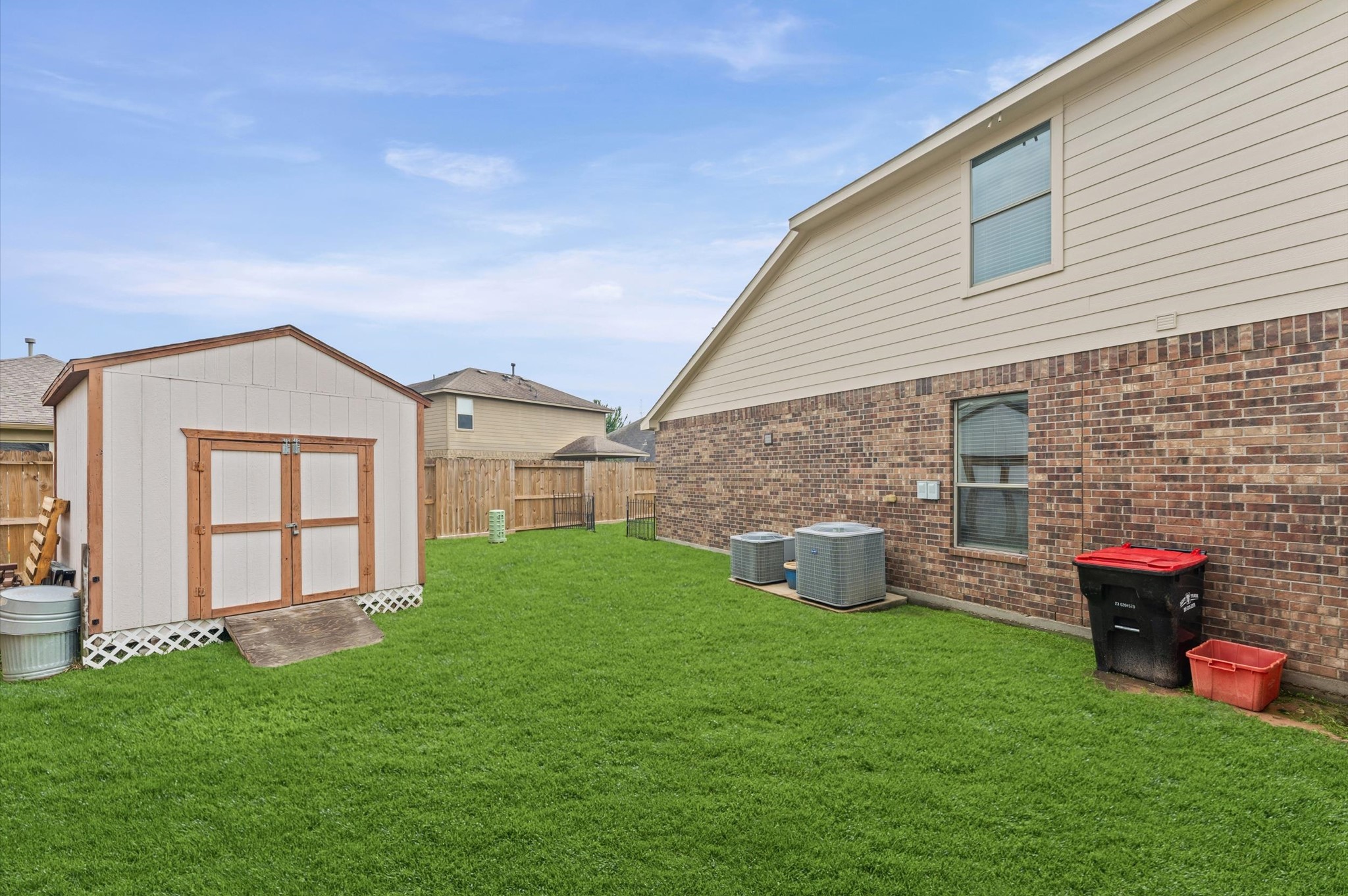 22534 Rustic Valley Court Porter, TX 77365 - Photo 23 of 27 a backyard of a house with table and chairs