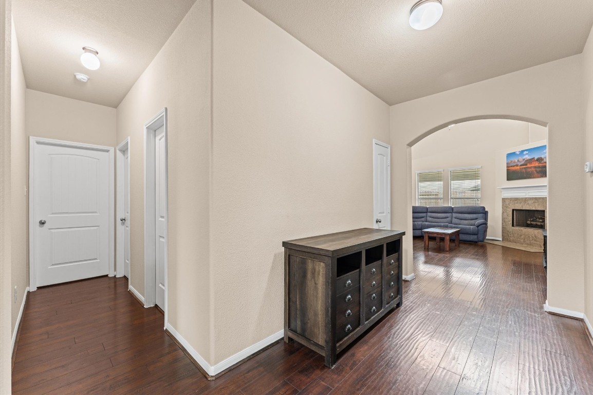 22534 Rustic Valley Court Porter, TX 77365 - Photo 8 of 27 a view of a livingroom with furniture hardwood floor and a ceiling fan