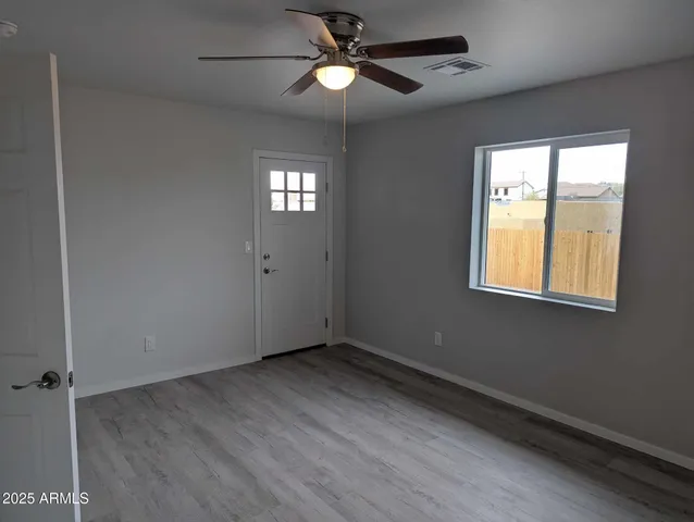 a view of an empty room with a window