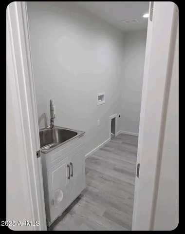 a bathroom with a sink and vanity