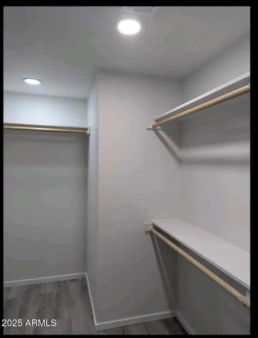 a view of storage and utility room with racks on the wall