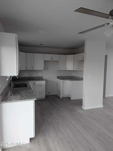 a kitchen that has a sink and a stove