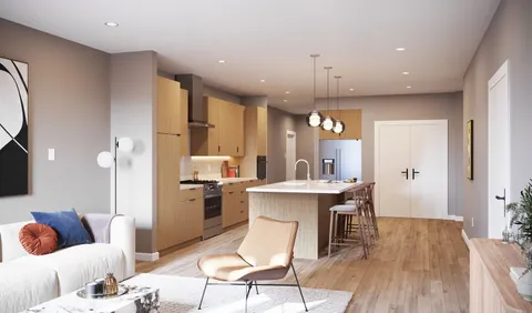 a living room with kitchen island granite countertop furniture wooden floor and a kitchen view