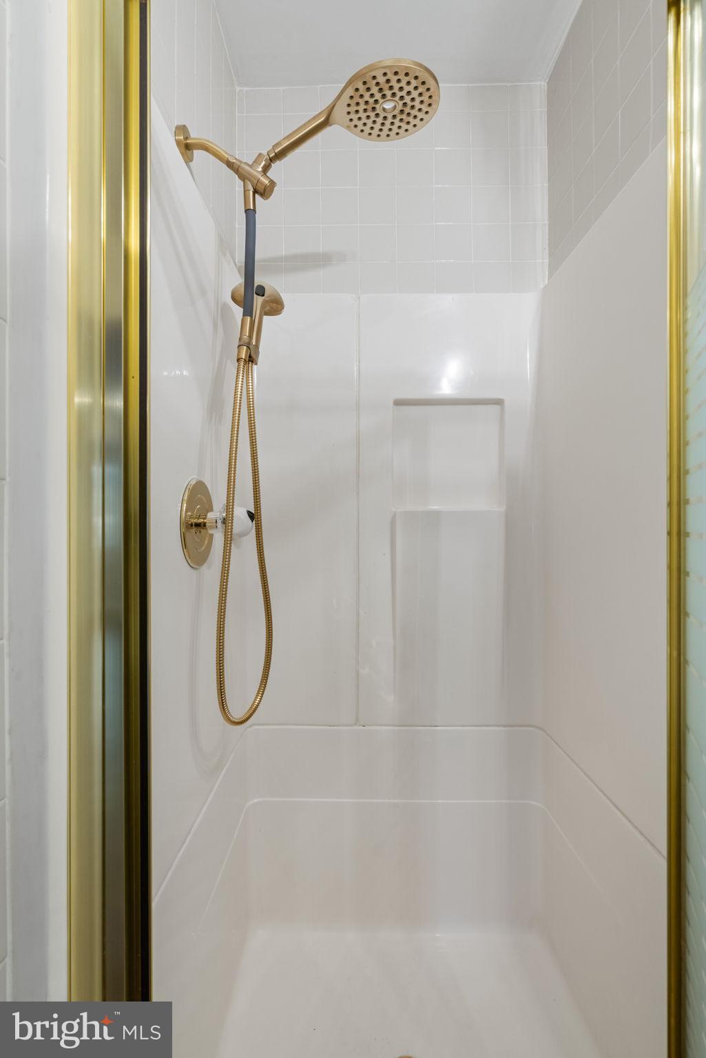 4009 Roberts Road Fairfax, VA 22032 - Photo 23 of 60 Elegant shower with gold accents.