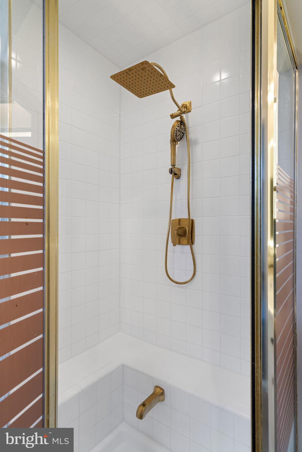 4009 Roberts Road Fairfax, VA 22032 - Photo 27 of 60 Elegant shower with gold fixtures.
