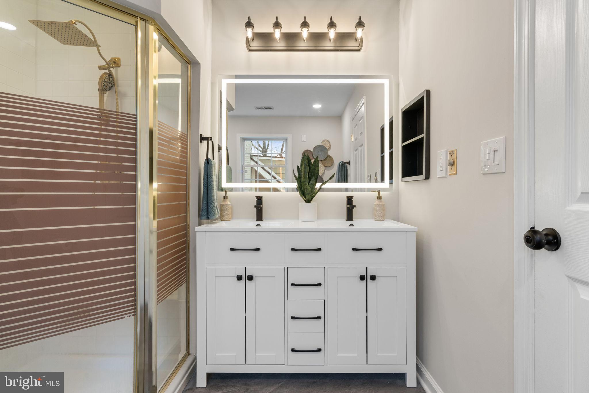 4009 Roberts Road Fairfax, VA 22032 - Photo 33 of 61 Modern bathroom with sleek design elements.