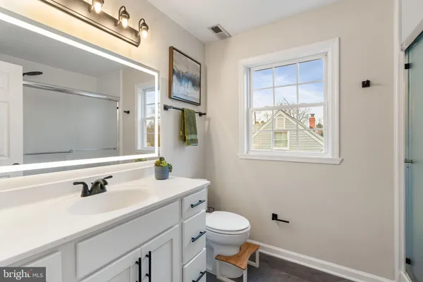 a view of a workspace with furniture and entryway