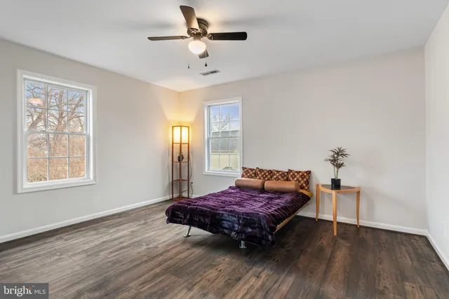 a view of a livingroom with furniture and wooden floor