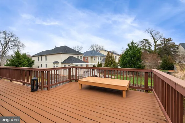 a view of a house with a wooden deck