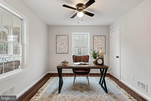 a workspace with furniture and window