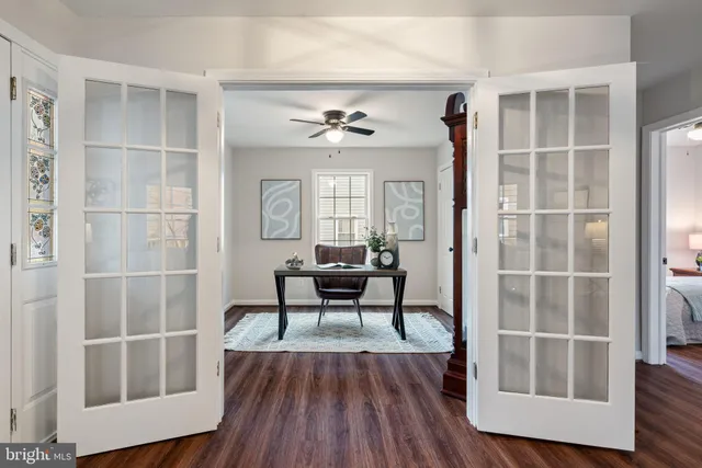 a view of a dining room with furniture wooden floor and chandelier