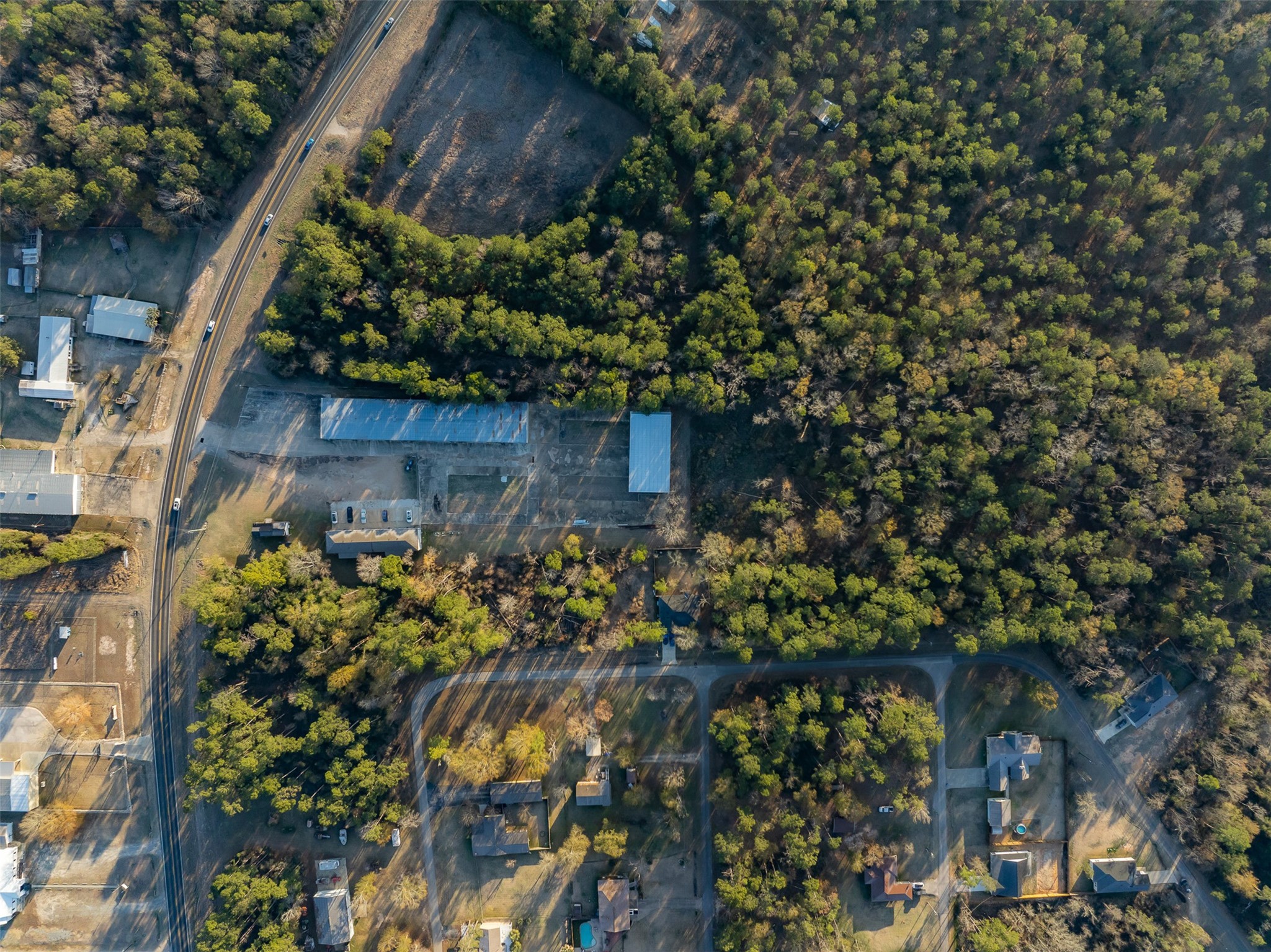 2001 Farm To Market Road 356 Onalaska, TX 77360 - Photo 17 of 35 a backyard of a house with lots of green space