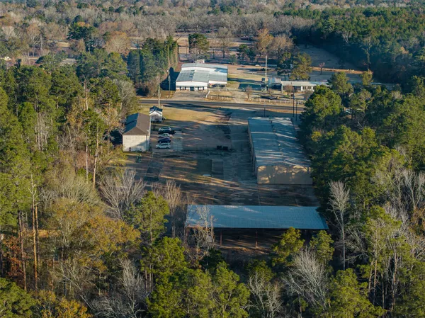 an aerial view of a house with yard and outdoor seating