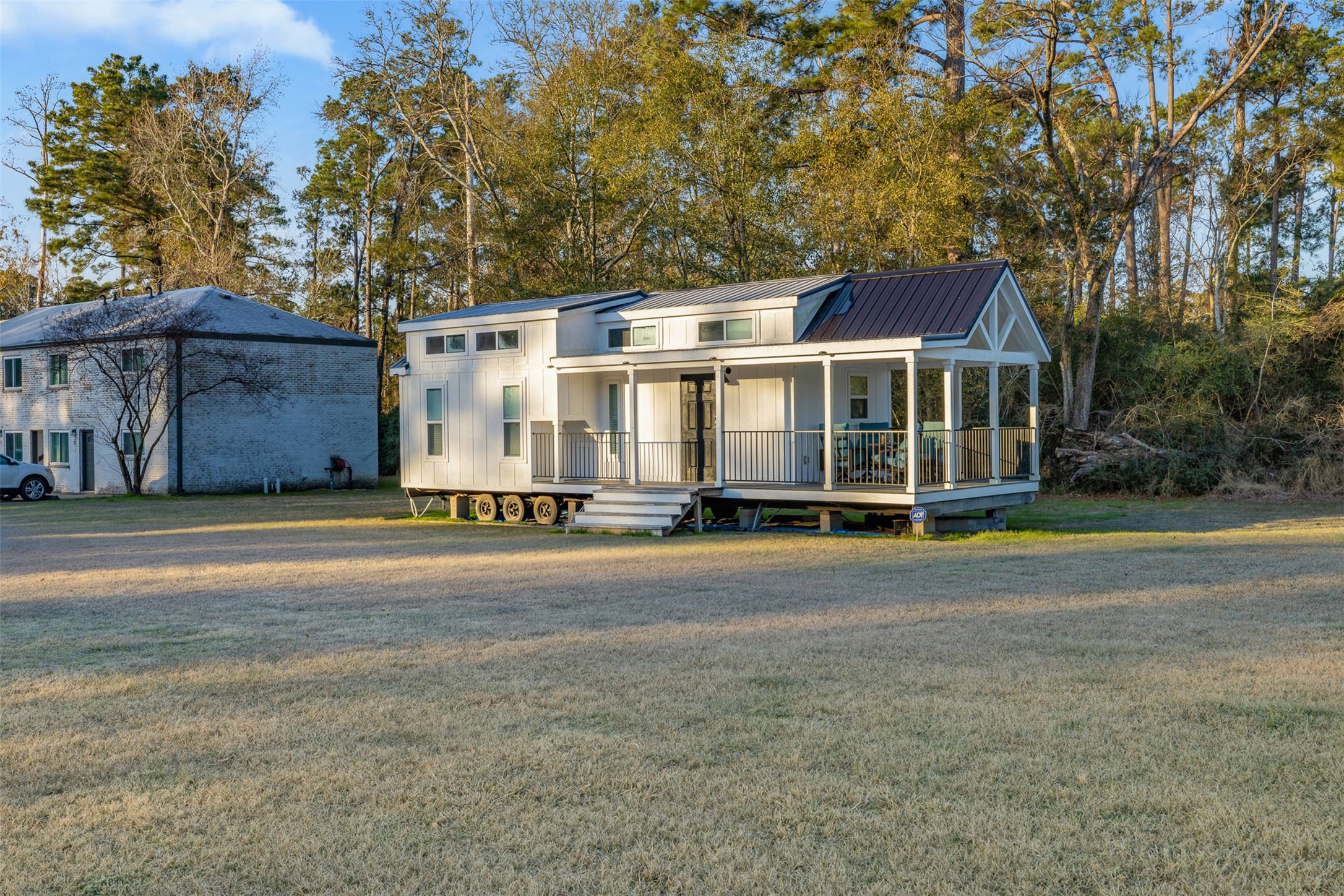 2001 Farm To Market Road 356 Onalaska, TX 77360 - Photo 10 of 35 a front view of a house with a garden